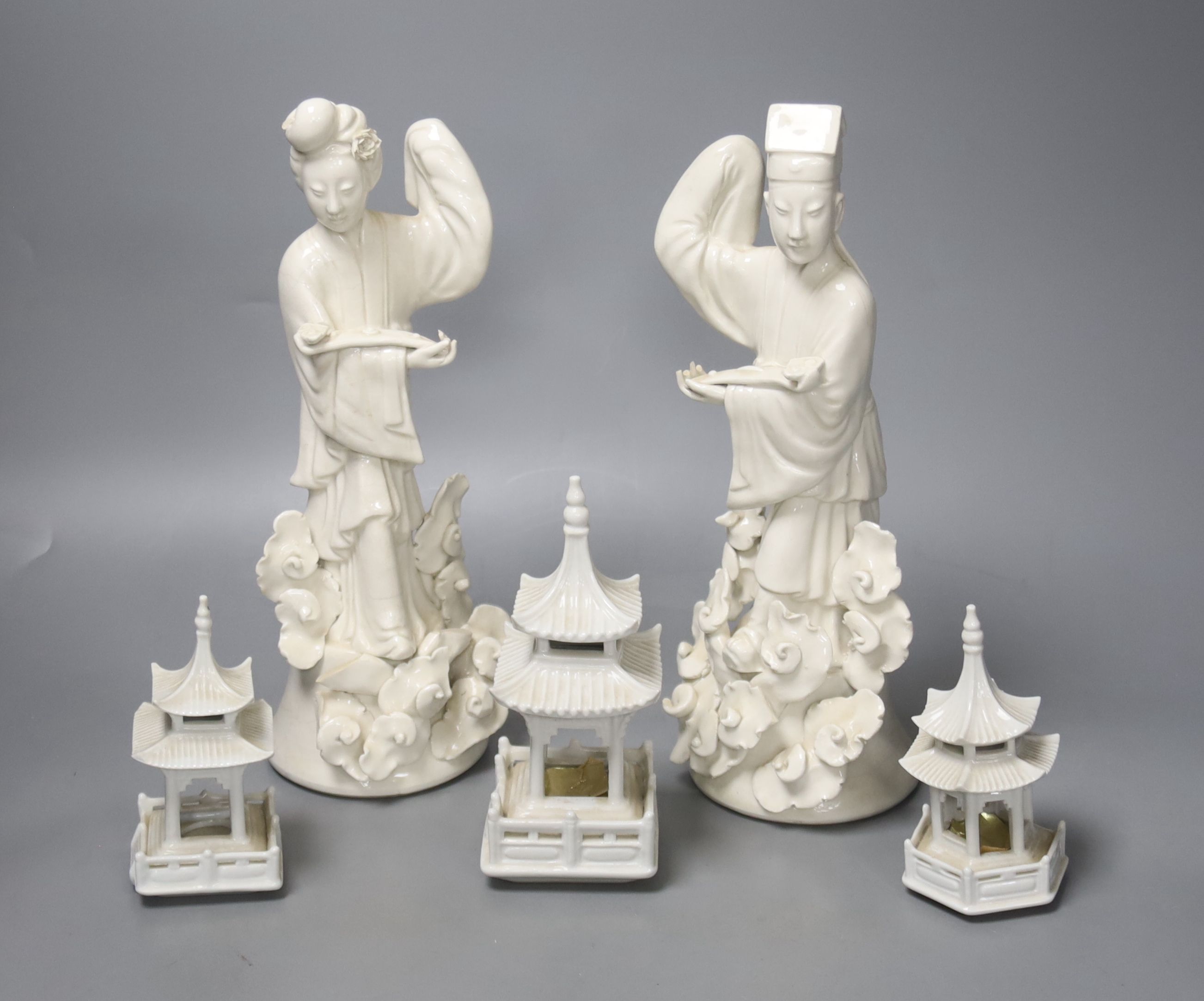 Two Chinese blanc de chine figures and three others, tallest 28cm